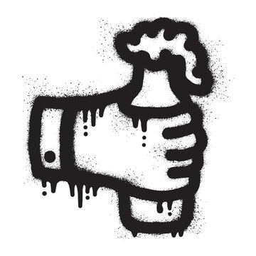 hand holding a beer bottle with black spray paint