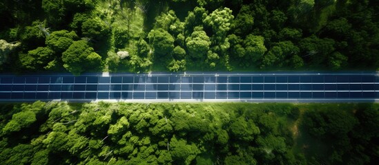 Bird s eye perspective of solar panel and road - Powered by Adobe