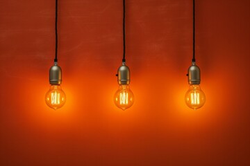 Three light bulbs hanging from a wall in a room with an orange wall and a light switch on the wall. Generative AI