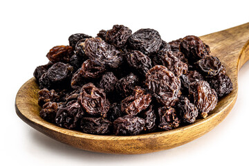 dried dried raisin made in brazil in rustic wooden spoon, isolated white background.
