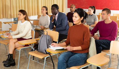 Woman in group of students in a university audience