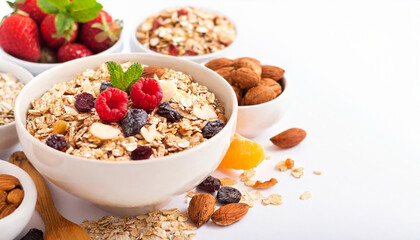 Muesli bowl, organic ingredients for healthy breakfast Granola, nuts, dried fruits, oatmeal, whole grain flakes on white background. Copy space - obrazy, fototapety, plakaty