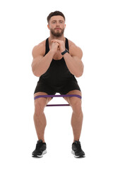 Young man exercising with elastic resistance band on white background