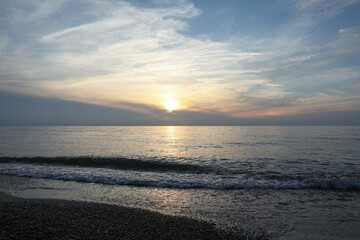 Picturesque view of sea and tropical beach at sunset