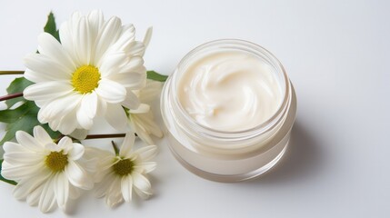 Fototapeta na wymiar whitening and moisturizing Face cream in an open glass jar and flowers on white background. Set for spa, skin care and body products and solutions for skin problems such as scars, acne, wrinkles.