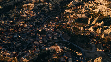 Goreme, Cappadocia, Turkey. View of the evening city from from drone