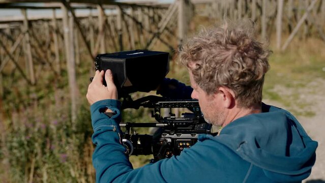 Filmmaker Holding His Professional Camera