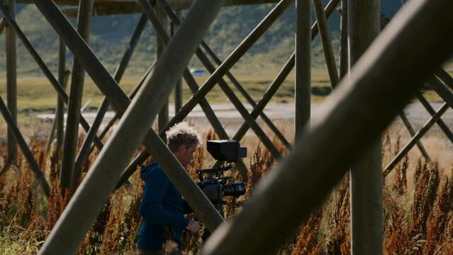 Man Recording Stockfish Rack And Curly Dock