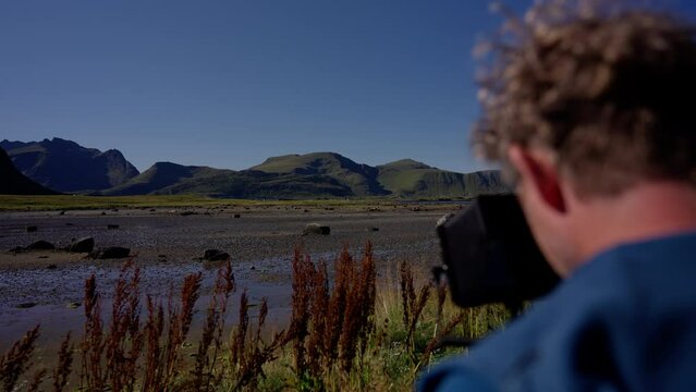Filmmaker Capturing The Scenic Landscape