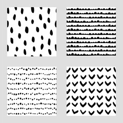 Set of 4 seamless abstract patterns in black and white. Repeat patterns with hand drawn abstract shapes and brushstrokes.
