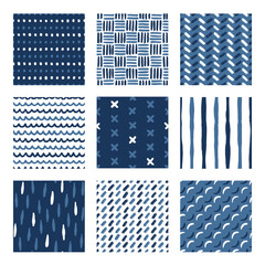 Set of vector seamless patterns with brush strokes and abstract marks in blue and white. Monochromatic abstract patterns.