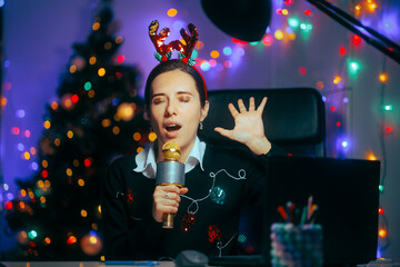 Woman With Karaoke Microphone Singing Christmas Carols at the Office. Party girl having fun at the office Xmas party 
 - obrazy, fototapety, plakaty