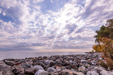 looking out across a large rock berm designed to stop wave erosion  and protect toronto's main...