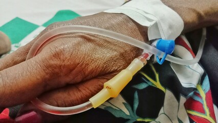 Doctor Drip Saline Intravenous To Patient In Hospital