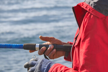 Fisherman with rod, spinning reel ,