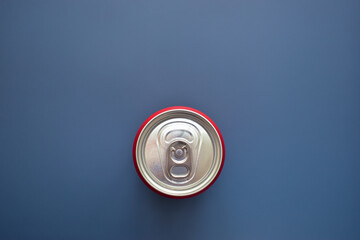 aluminium red cans soft drink put on blue texture background