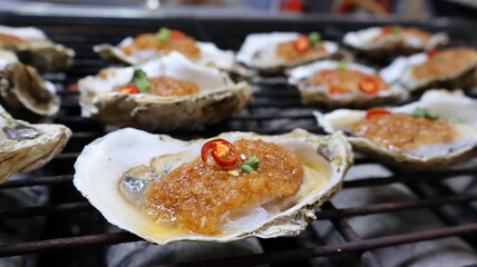 Grilled Roasted Stuffed Oysters with Spicy Hot chilli pepper in China Street Food 
