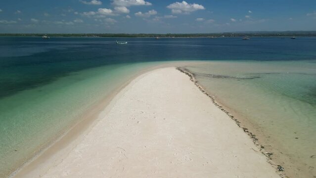 Aerial video capture of the pristine Indonesian island of Lombok, an hidden gem that captivates travelers with its otherworldly beauty.  Gili Kere epitomizes the beauty of an untouched island.