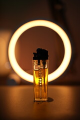 a ring light is glowing behind a lighter