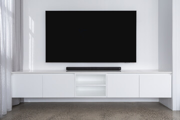 Blank TV in bright, light-filled room.