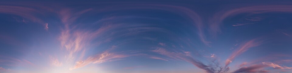Sunset sky panorama with bright glowing pink Cirrus clouds. Seamless hdr 360 panorama in spherical...
