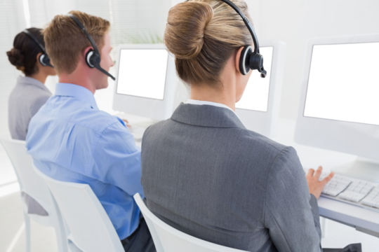 Digital png photo of diverse business people using computers at desks on transparent background