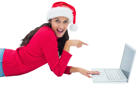 Digital png photo of biracial woman with christmas hat using laptop on transparent background - Powered by Adobe