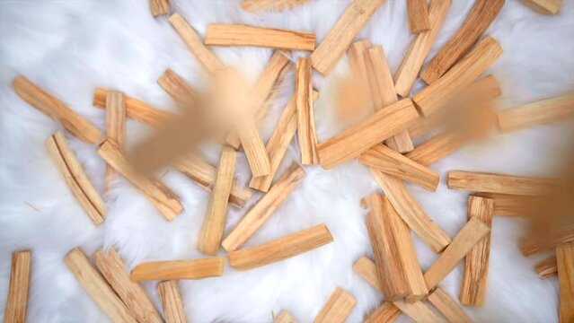 Palo santo Aromatherapy ritual meditation falling over more stick wood ceremonial sacred incense in slow motion