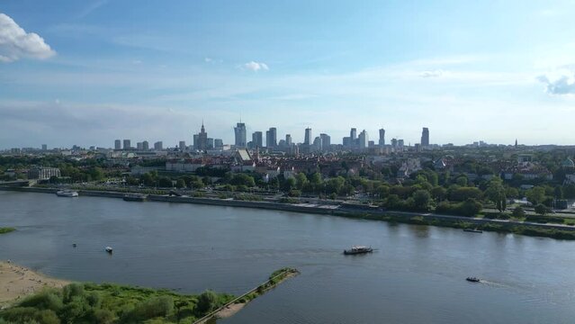 Aerial panorama of Warsaw, Poland over the Vistual river and City center in a distance Old town. Downtown skyscrapers cityscape. Business