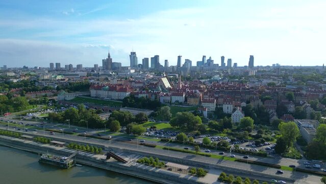 Aerial panorama of Warsaw, Poland over the Vistual river and City center in a distance Old town. Downtown skyscrapers cityscape. Business