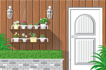 Front garden with white modern door and plant pot shelf on wooden wall background.