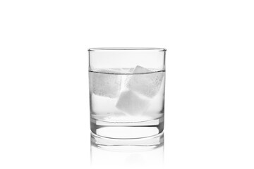 Ice cubes dropping into a glass of water
