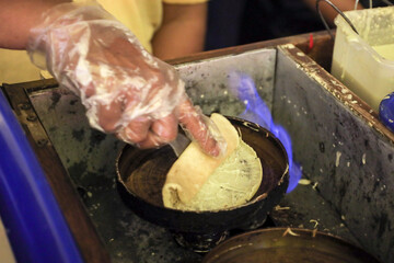 Chef make leker cakes or crepes, Indonesian traditional snacks made from flour with sweet, savory...