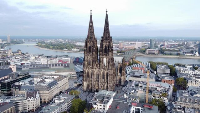 Cologne Cathedral - Renowned Landmark In Cologne, Germany. Rhine River In Background. aerial pullback
