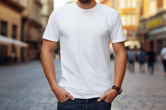 Man in white blank t-shirt standing on city street. Mock-up t-shirt.