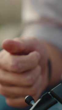 A man screws a joystick into a drone controller. close-up shot. Day, outdoor. 