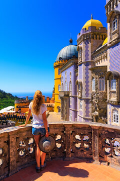 Woman tourist enjoying view of Pena Palace- Sintra, Lisboa, Portugal