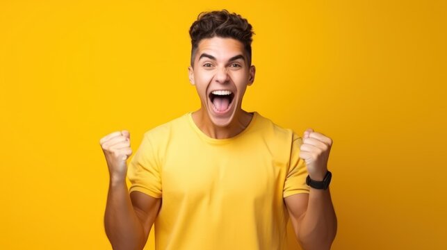 Exciting man, winning emotion yellow background 