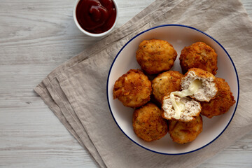 Homemade Cheesy Chicken Nuggets with Ketchup, top view. Copy space.