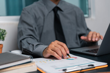 Businessman chart analysis document work financial plan marketing with laptop