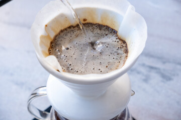 brewing coffee with the v60 method 
