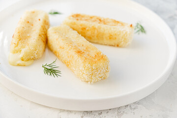 mozzarella sticks on the white plate