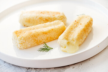 mozzarella sticks on the white plate