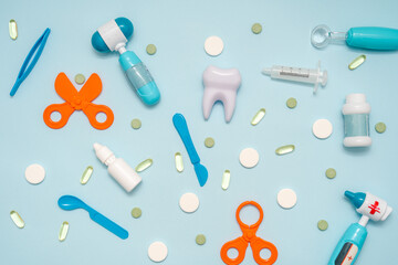 Various healthcare and medical accessories on blue background. Flat lay