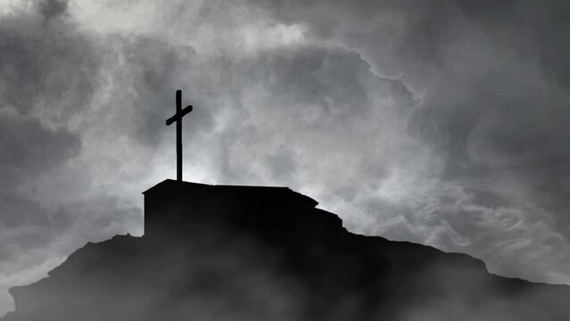 grave with cross on top of mountain silhouette