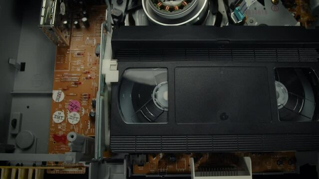 VHS Tape Playing in a VCR Dolly