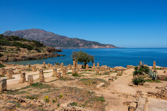 Ruins of the Roman Archeological Park of Tipaza ( Tipasa ), Algeria. Mount Chenoua and the Meditarranean sea in the background.