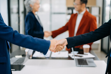 Business partnership handshake concept.Photo two coworkers handshaking process.Successful deal after great meeting. in office.