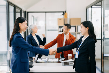 Business partnership handshake concept.Photo two coworkers handshaking process.Successful deal after great meeting. in office.