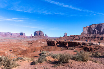 travel usa and north america, Monument Valley, view at John Ford Point with people on it,  in the background visible Elephant Butte, Merrick Butte, West mitten Butte and East Mitten Butte